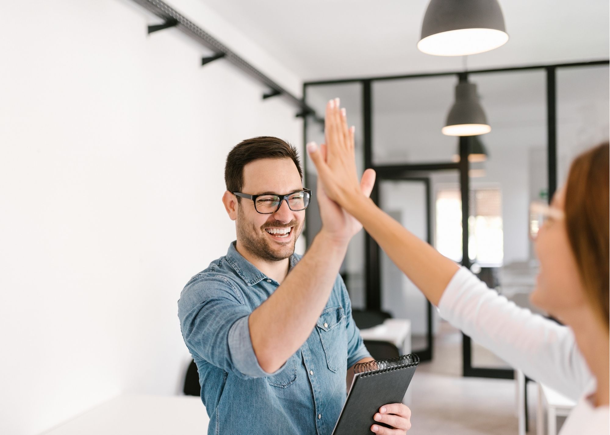 How to boost employee engagement, coworkers high fiving, PR agency