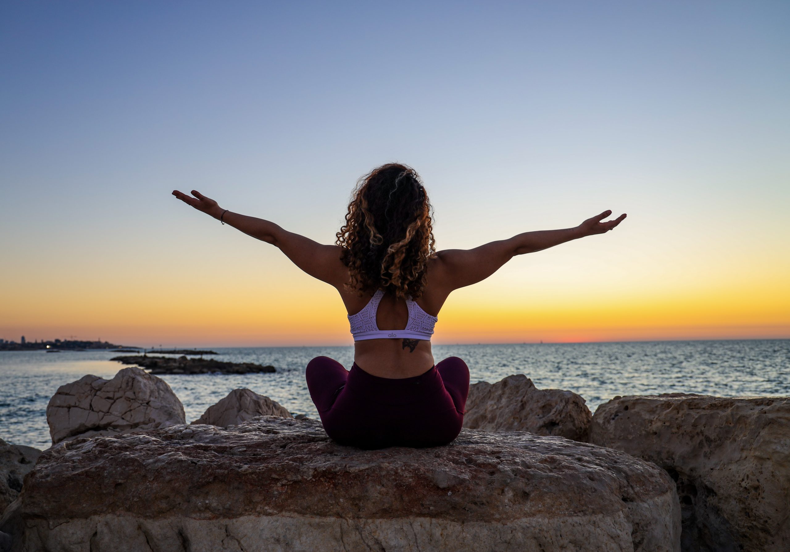 woman meditating at beach, mental health