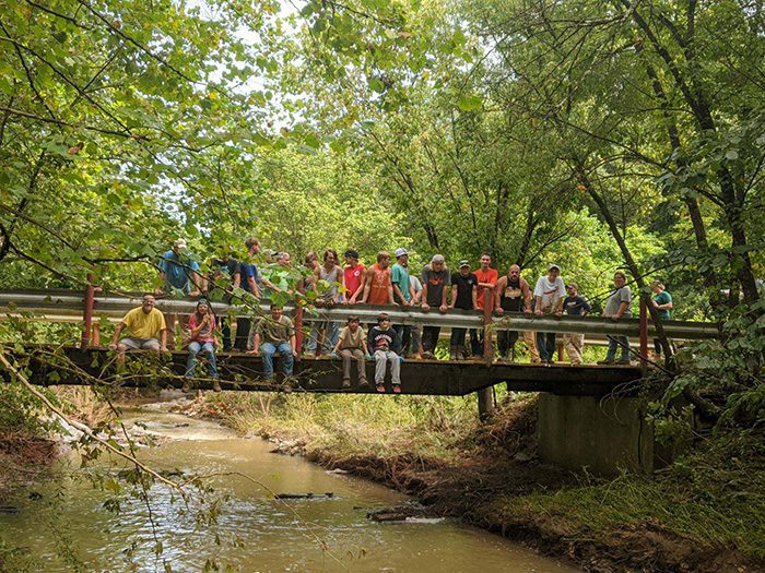 n1zmt football team helps repair broken bridge 3 1
